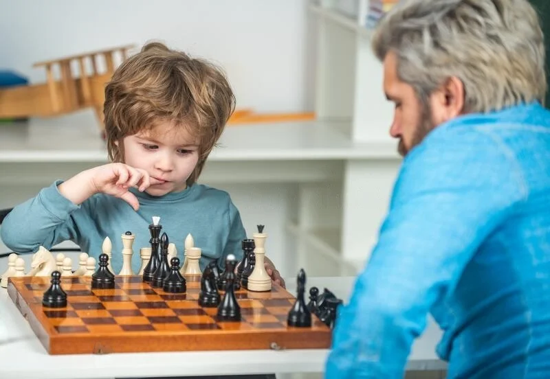 teach chess father